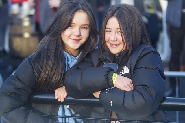 Orla Armstrong and Darcy Anderson watching Saturday's Melrose Sevens