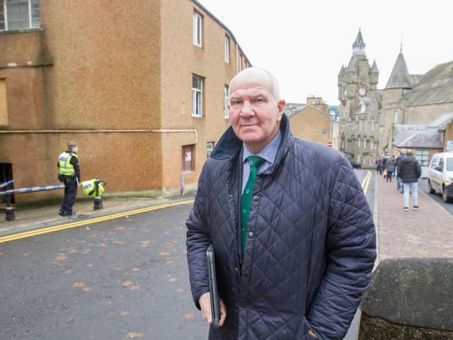Town provost Watson McAteer at the site of the blaze adjacent to the town's vaccination centre. (Photo: BILL McBURNIE)