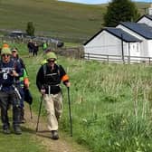 Sue Fletcher Watts arrives at Kirk Yetholm on Saturday, along with her fellow walkers.