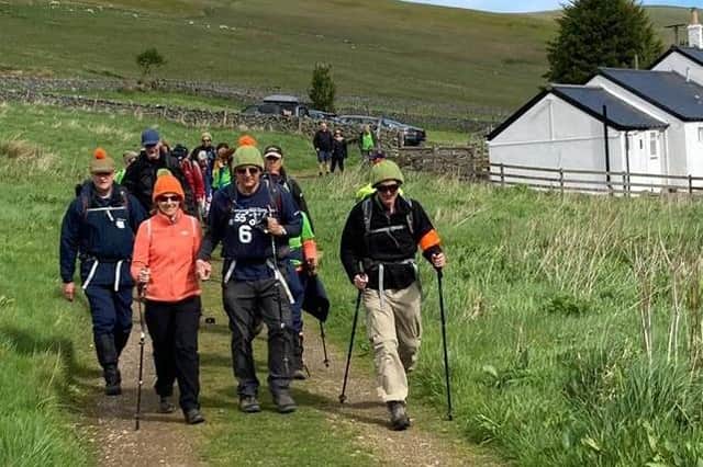 Sue Fletcher Watts arrives at Kirk Yetholm on Saturday, along with her fellow walkers.