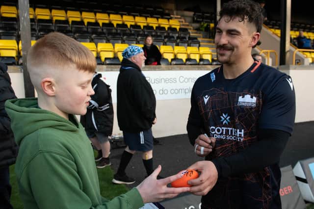 Former Melrose winger Damien Hoyland signing an autograph during Edinburgh's open training session in the Borders (Pic: Ross Parker/SNS Group/SRU)