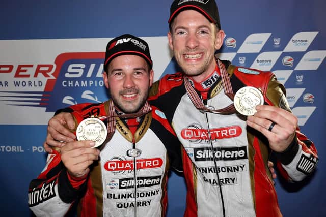 Lauder's Steve Kershaw, right, and Ryan Charlwood celebrating their success at the Sidecar World Championship's finale in Portugal (Pic: Mark Walters)