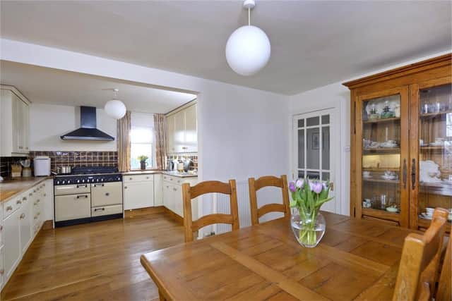 The kitchen benefits from a solid oak flooring, integrated appliances and a Rangemaster cooker.