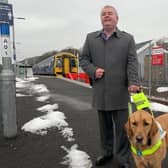Council convener David Parker and his guide dog Clive at Tweedbank Railway Station.