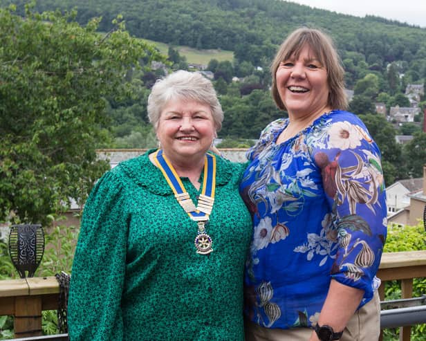 Lynda Stoddart presents her mother Elizabeth Norman with the Rotary chains of office. (Photo: BILL McBURNIE)