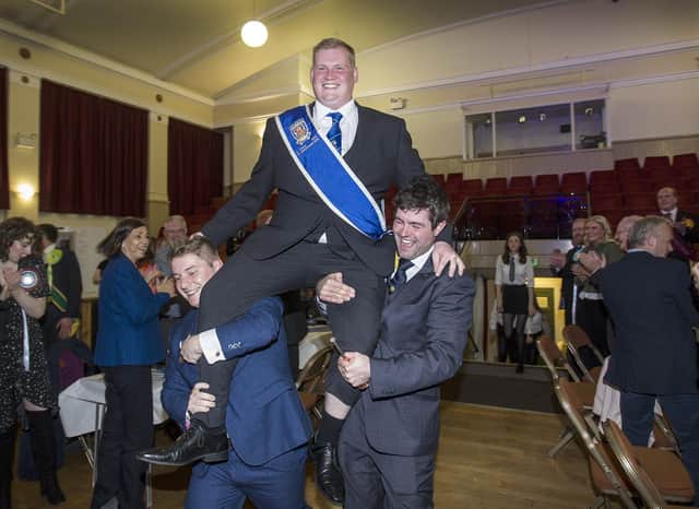 Kelsae Laddie for 2022, Callum Davidson is lifted aloft by Sean Hook and Mark Henderson into the reception at the Tait Hall. (Photo: BILL McBURNIE)
