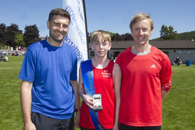 Matty Fleming (Kelso), 1600m youth handicap winner, with dad Matthew and Earlston Games rep Robert Whittaker