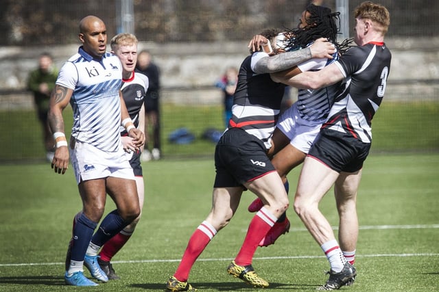 South African rugby sevens legend Cecil Afrika being tackled by Kelso's Bruce McNeil at Melrose Sevens