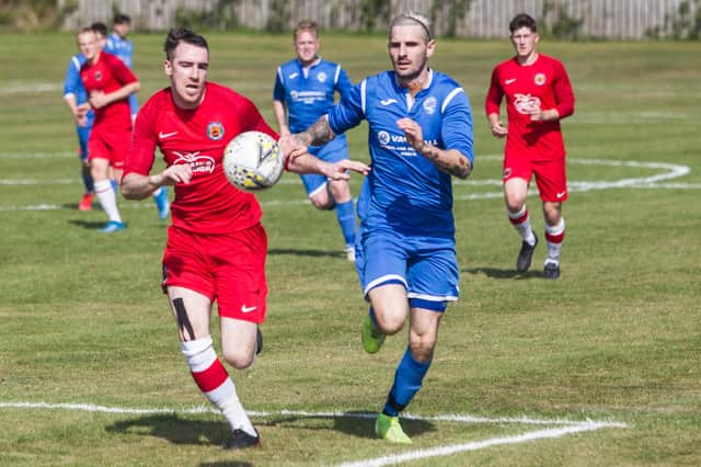 Taylor Hope for Hawick Royal Albert challenging for the ball against Golspie Sutherland (Pic: Bill McBurnie)