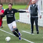 Civil Service Strollers' Lewis Duffy vying for possession with Gala Fairydean Rovers' Ross Aitchison as home boss Neil Hastings looks on (Photo: Bill McBurnie)