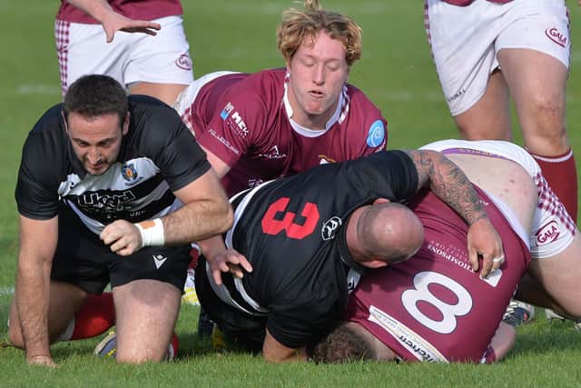 Kelso's Allan Frame tackling Gala's James Glendinning, with Glen McCrum getting in on the action (Pic: Alwyn Johnston)