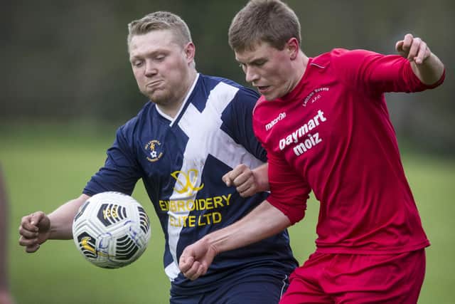 Jed Legion's Steven Anderson going up against Leithen Rovers' Andrew Edmiston (Photo: Bill McBurnie)