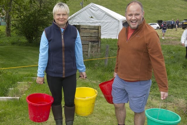 Leah Arnott and Craig McCreadie fetching water for the horses at Mosspaul.