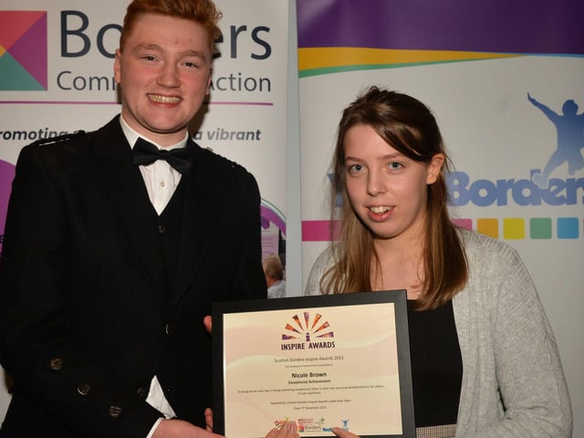 Exceptional Achievement, winner Nicole Brown is presented with her certificate by Cory Paterson.
