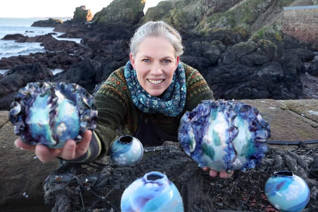 Belinda Glennon from Stow with her ceramic “sea pods”. Photo: Colin Hattersley.