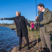 Watched by anglers including RTC chairman, Peter Straker-Smith (right), Mairi Gougeon MSP blesses the River Tweed with a dram of whisky as she officially opens the river’s 2023 salmon fishing season. Photo: Phil Wilkinson.