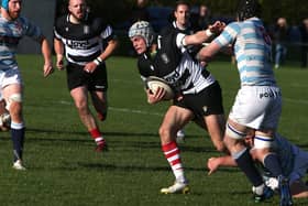 Kelso's Dwain Patterson fending off an Edinburgh Academical tackle at home at Poynder Park on Saturday (Photo: Steve Cox)
