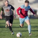 Ben Dickson on the ball for St Boswells, with Lee Stephen giving chase, during their 12-1 win at home to Selkirk Victoria on Saturday in the Border Amateur Football Association's B division (Photo: Brian Sutherland)