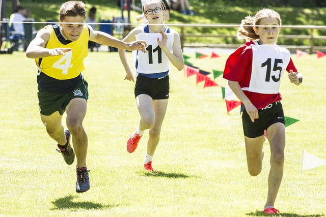 Kelso's Evie Leonard, right, winning the 400m youth handicap