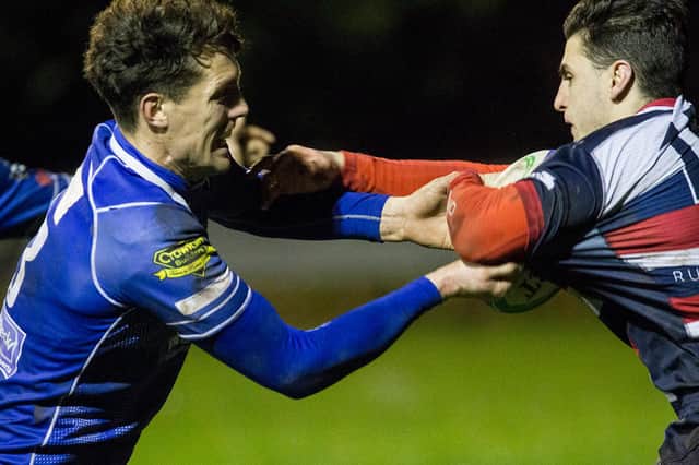 Jed-Forest's Gregor Young getting to grips with an Aberdeen Grammar opponent at Riverside Park on saturday (Photo: Bill McBurnie)