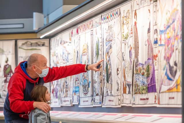 Some of the first visitors to the new attraction, Michael Huitson and daughter Audrey , travelled from Cheshire to take a close look at the tapestry in its new home. Photo: Phil Wilkinson.