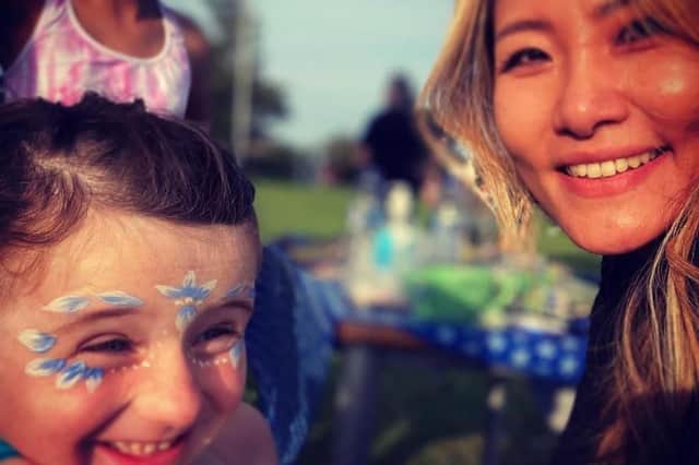 Face painting fun for Holly and Sukjin.