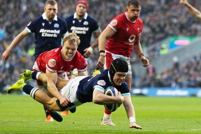 Darcy Graham scoring Scotland’s third try of their 35-29 win against Wales in rugby’s Six Nations at Edinburgh’s Murrayfield Stadium on Saturday (Photo by Ross MacDonald/SNS Group/SRU)