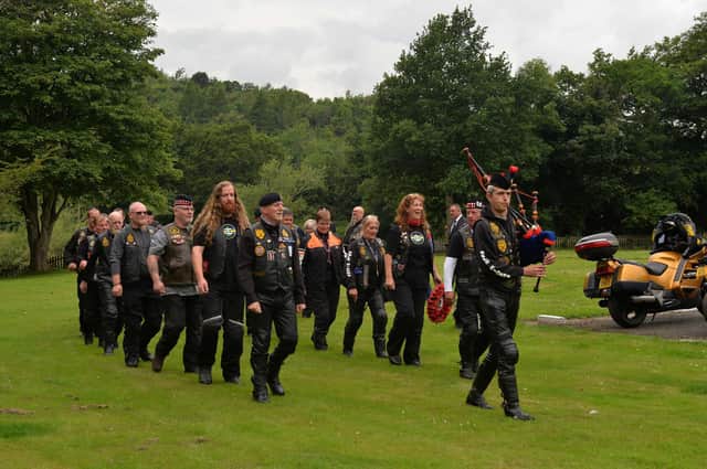 The parade of bikers are piped to the service at Dryburgh Abbey.