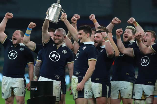 David Cherry and Cameron Redpath raise the Calcutta Cup aloft after their victory during the Guinness Six Nations match between England and Scotland at Twickenham Stadium on February 6, 2021. (Photo by David Rogers/Getty Images)