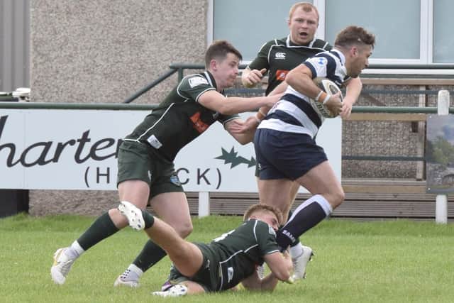 A Lewis Ferguson tackle halts a Heriot's attack as Kirk Ford and Gareth Welsh offer cover (Photo: Malcolm Grant)