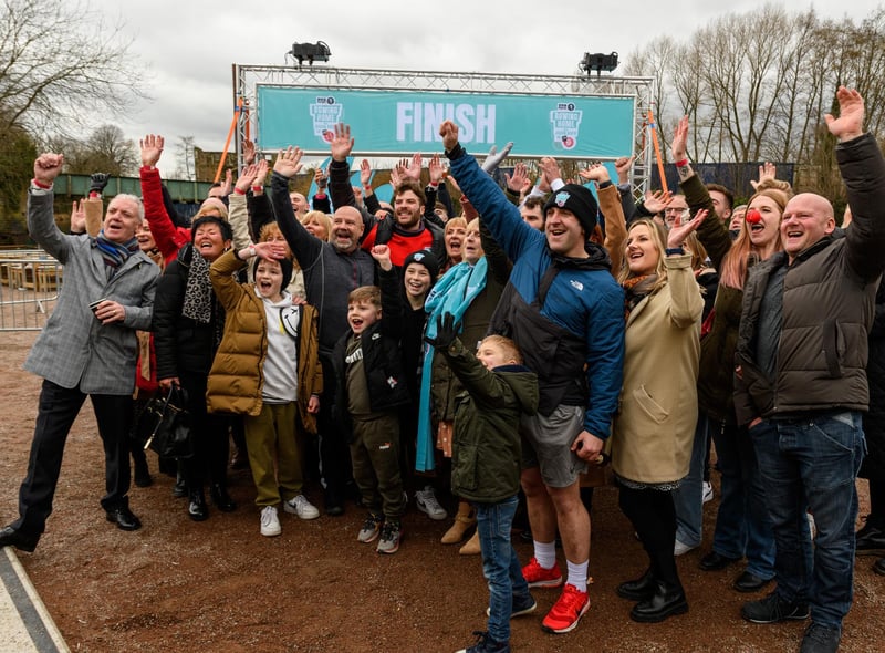 Jordan North celebrates the end of his 100 mile rowing challenge in aid of Comic Relief with friends and family. Photo: Kelvin Stuttard