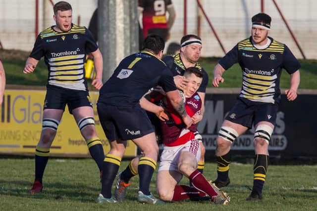 Gala's Fergus Johnston being brought down by Dundee (Photo: Bill McBurnie)