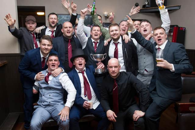 Hawick Colts players and coaches celebrating winning the Collie Cup at Coopers Bar in Hawick High Street (Photo: Bill McBurnie)