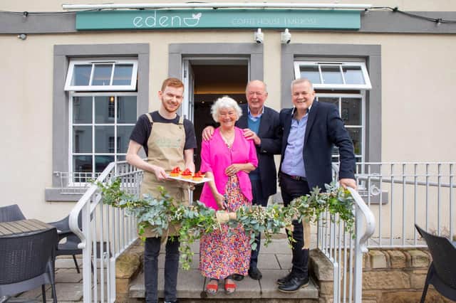 Outside the cafe are Robbie Peters, Moira Peters, David Peters (Snr), and David Peters.