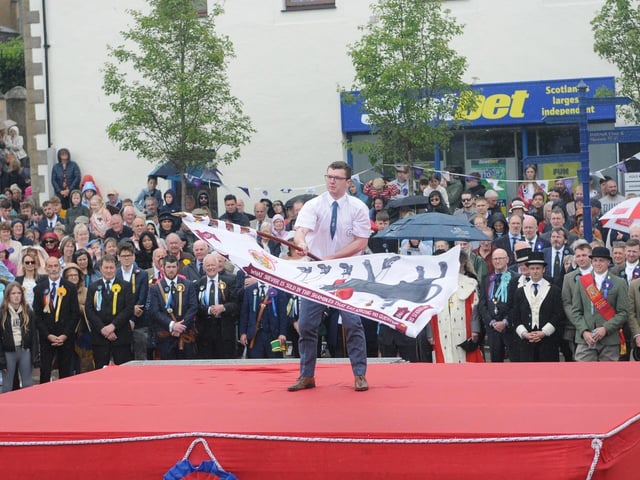 Fleshers standard bearer Struan Legge.