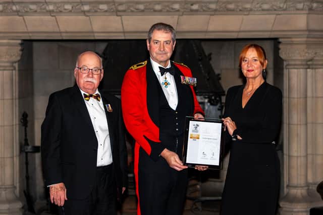 Councillor John Greenwell and Vicky Cashmore receive the ERS Gold Award for Scottish Borders Council from Major General Bob Bruce CBE DSO, Governor of Edinburgh Castle.