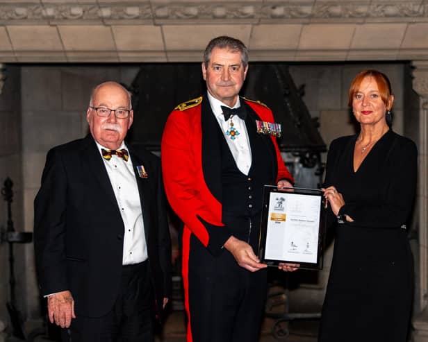 Councillor John Greenwell and Vicky Cashmore receive the ERS Gold Award for Scottish Borders Council from Major General Bob Bruce CBE DSO, Governor of Edinburgh Castle.