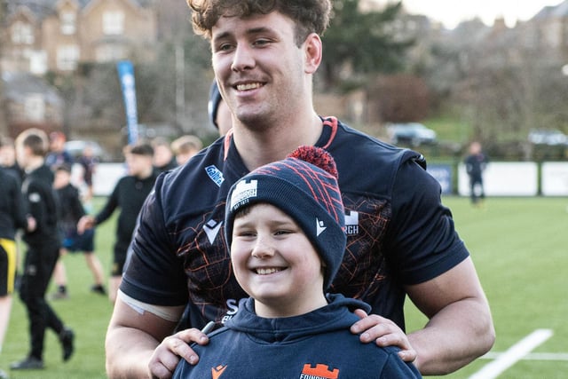 Edinburgh flanker Connor Boyle posing for a picture with a fan during an open training session at the Greenyards in Melrose (Pic: Ross Parker/SNS Group/SRU)