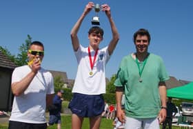 Cameron Rankine, winner of St Boswells village race's class for male runners aged 16 to 39, with runner-up Hugo Lee and third-placed Peter Farquhar