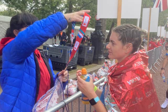 Fiona receives her medal after finishing in London