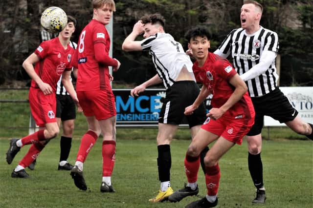 Hawick Royal Albert and St Andrews United challenging for an aerial ball in Fife on Saturday (Photo: John Stevenson)