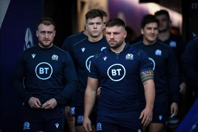 Stuart Hogg and Rory Sutherland taking to the pitch at Murrayfield Stadium in Edinburgh in February last year (Photo by Andy Buchanan/AFP via Getty Images)