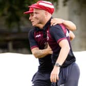 Selkirk skipper Daniel Heard, back, congratulating teammate Rory Banks on a catch out on the midwicket boundary, off the bowling of Greg Fenton, during a two-wicket loss for the Souters at home to Tranent and Preston Village seconds on Saturday (Photo: John Smail)