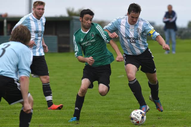 Hawick Waverley captain Jamie Richardson, right, vying for possession with Chirnside United's Paul Blacklock backin in 2015 (Photo: Stuart Cobley)
