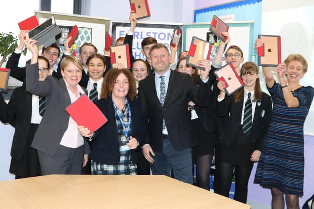 Earlston High School pupils and teachers with council leader Shona Haslam and councillor Carol Hamilton, receiving their ipads in 2019.