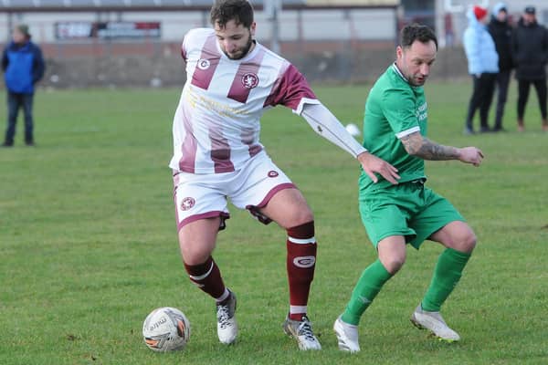 Goal-scorer Craig McBride on the ball for Langlee Amateurs, with Robert Reid challenging, during their 3-1 win at home to Chirnside United on Saturday in the Border Amateur Football Association’s A division (Photo: Grant Kinghorn)