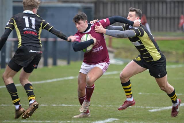Gala's Ben Gill being tackled by Melrose's Donald Crawford and Hamish Weir (Pic: Alwyn Johnston)