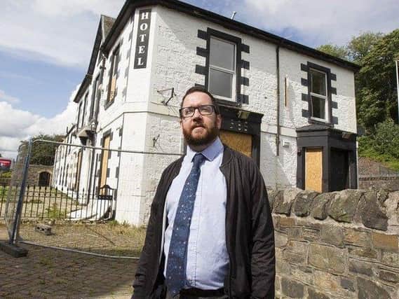 Councillor Euan Jardine outside the former Abbotsford  Arms Hotel. (Photo: BILL McBURNIE)