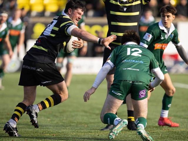 Patrick Anderson on the ball for Melrose, fending off Luke Scott, as they beat Hawick 33-12 at home at the Greenyards on Saturday (Photo: Andy McLean)