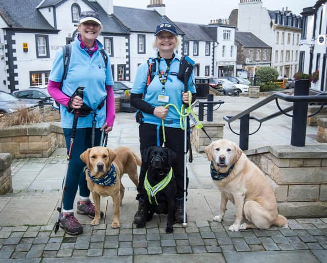 Walkers Jan Shirley and Shona Ramsay from Jedburgh, finishing their St Cuthbert's Way walk at Melrose. (Photo: BILL McBURNIE)